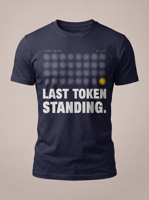 The Last Token tee in Navy. Fitted mockup. Printed: TOKEN METER / 1 LEFT / LAST TOKEN / STANDING.